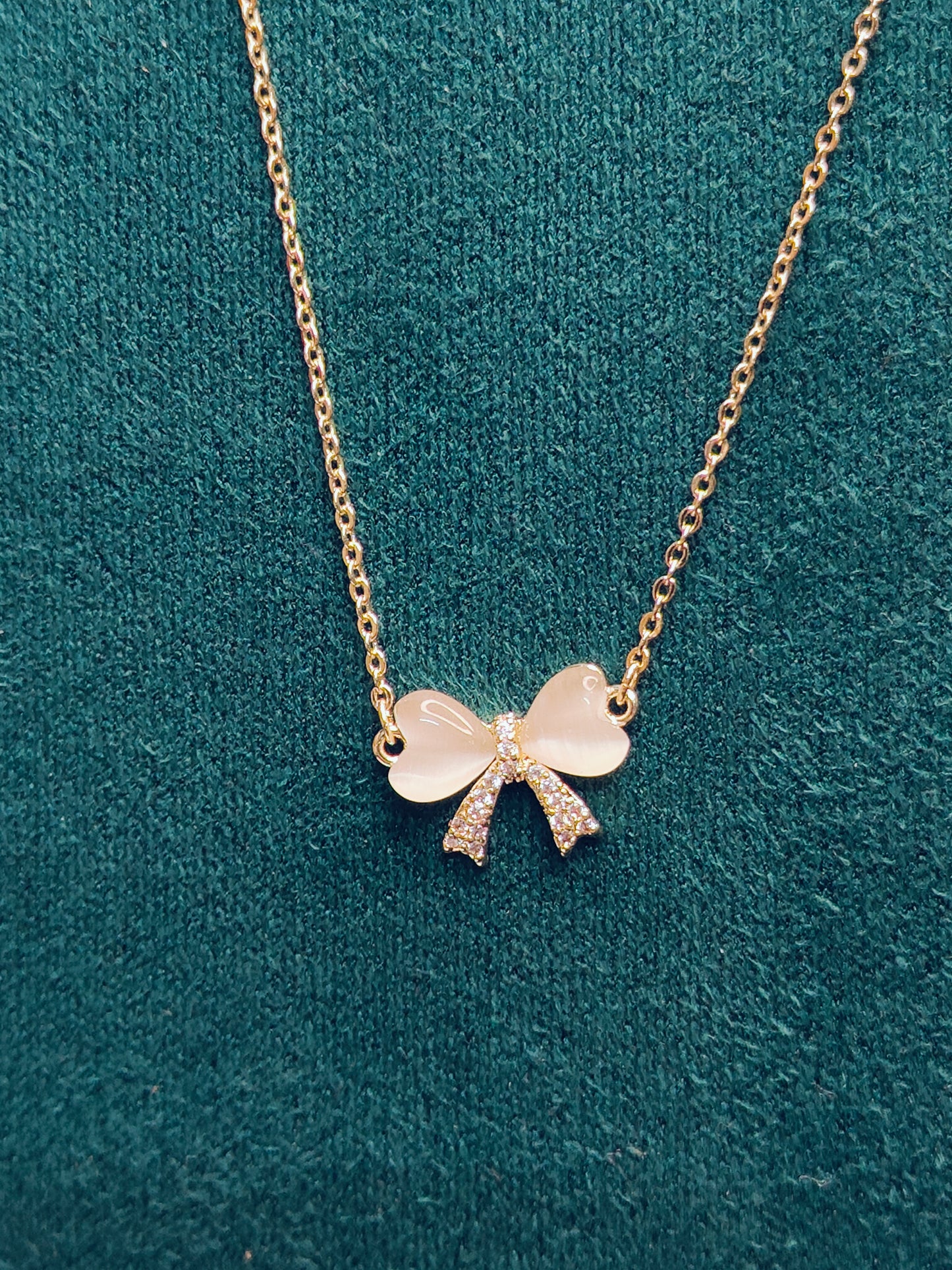 Gold Bow With Heart Shape Stone Necklace